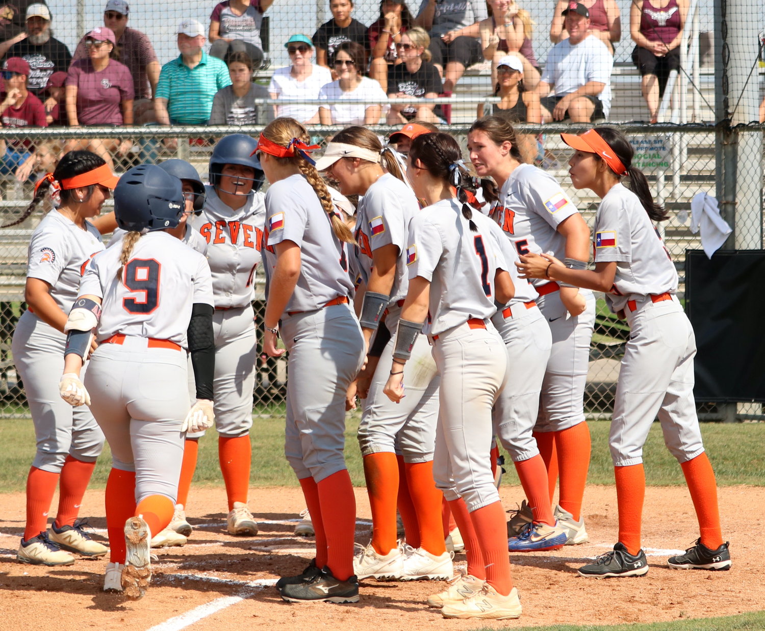 Amy Abke heads towards home plate as her teammates celebrate an Abke home run during Saturday’s Class 6A Regional Quarterfinal game between Seven Lakes and George Ranch at the George Ranch softball field.