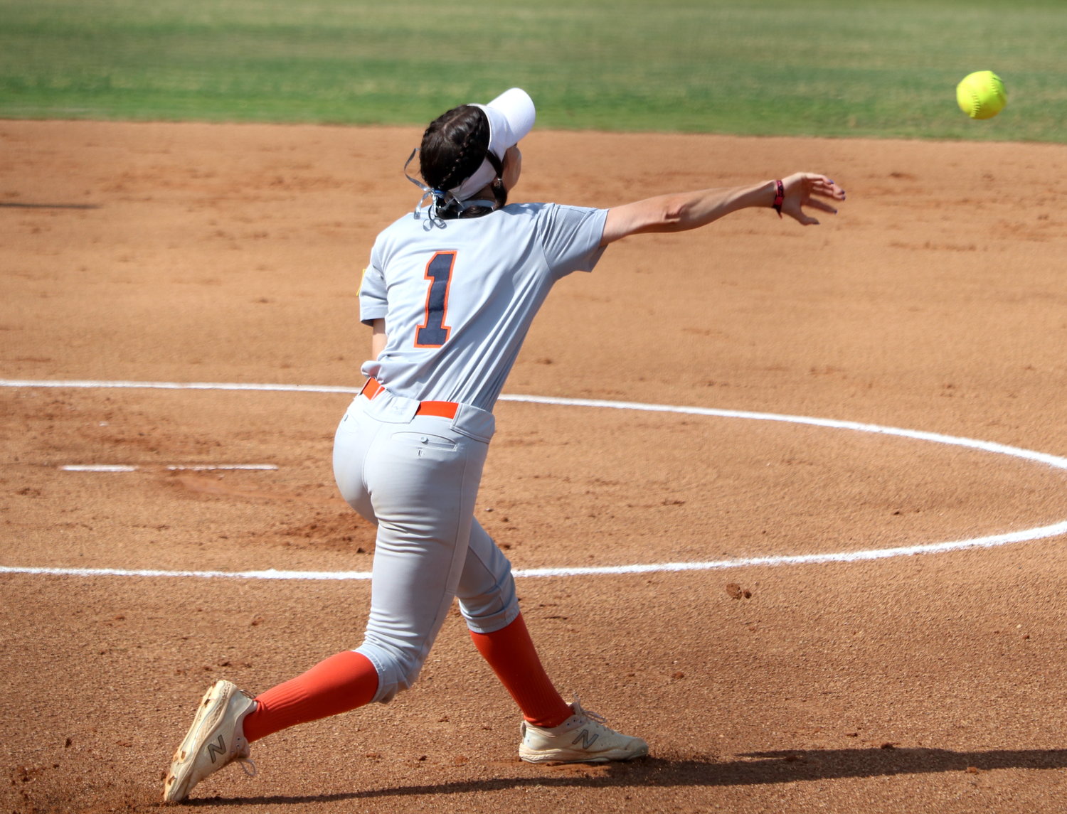 Kamryn Wallman throws to first base during Saturday’s Class 6A Regional Quarterfinal game between Seven Lakes and George Ranch at the George Ranch softball field.