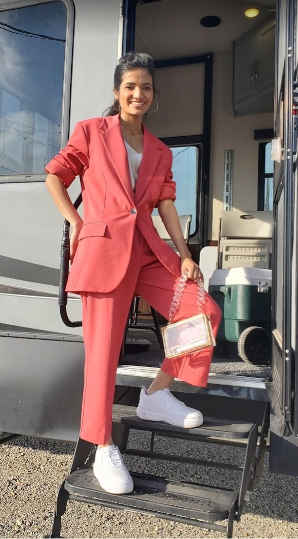 Rimi stands at her trailer before filming a Famous Footwear television commercia. (Recent Tompkins graduate appears in television commercial.