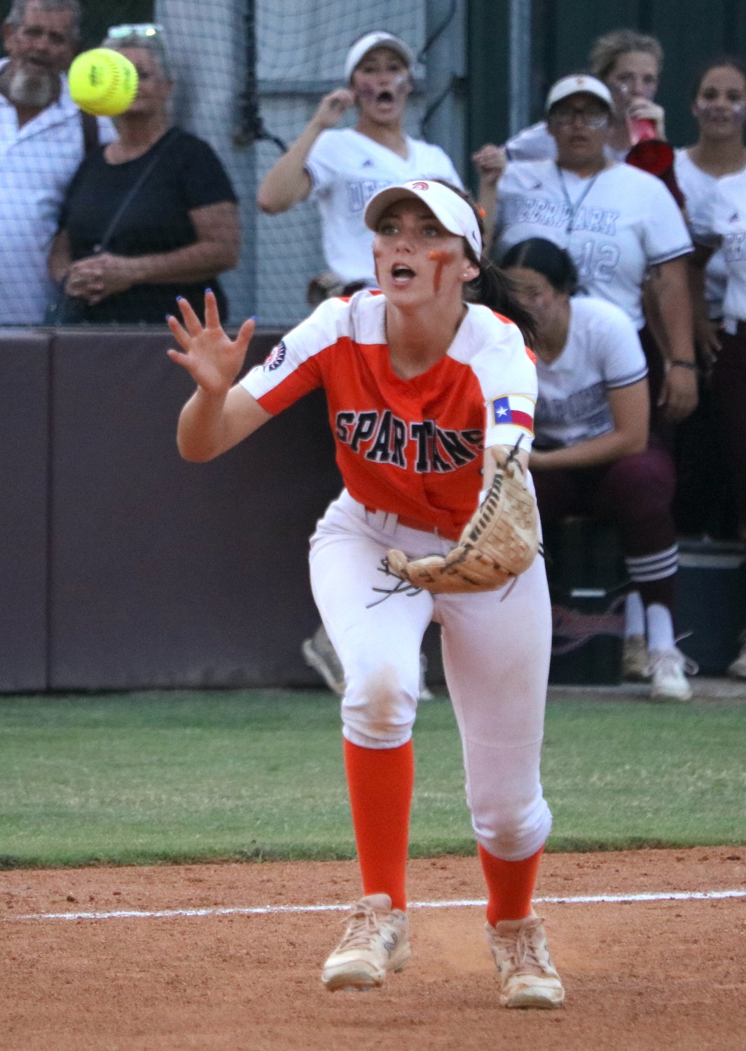 Kamryn Wallman reaches to catch a fly ball during Friday’s Class 6A Regional Semifinal between Seven Lakes and Deer Park at the Summer Creek softball field.