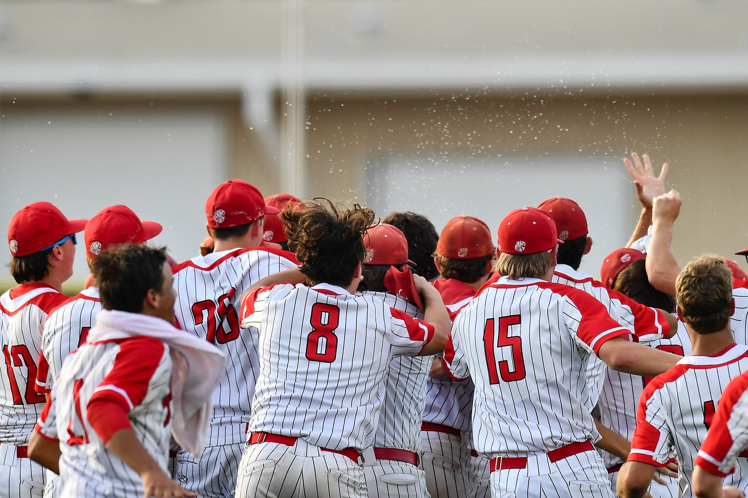 Katy Tigers celebrate the win after a home run hit by Katy's Sutton Hull (20) during the eight inning during a Region III-6A quarterfinals baseball game at Langham Creek High School, Saturday, May 21, 2022.