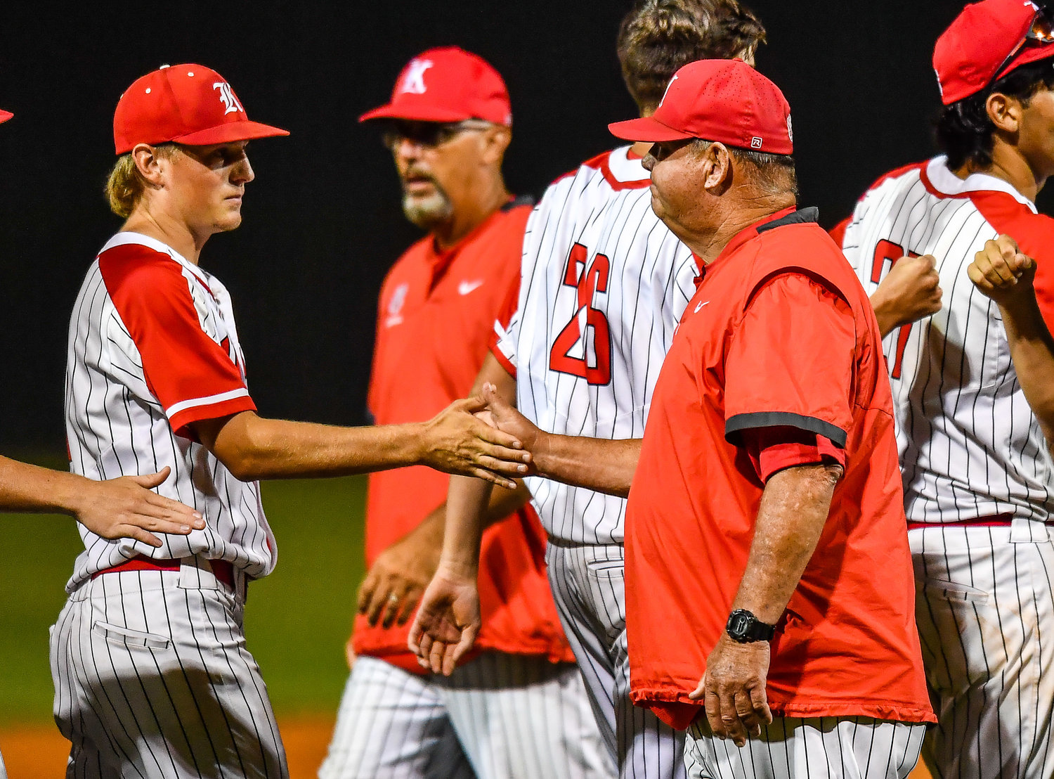 Katy's Tom Mcpherson (hc) congratulates players after winning game two during a Region III-6A Regional SemiFinals baseball game between Katy and Strake Jesuit at Mayde Creek High School, Friday, May 27, 2022.