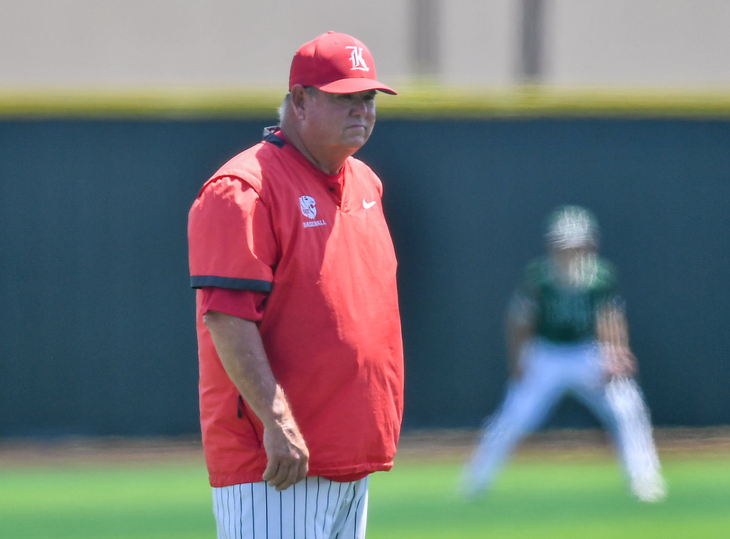 Katy's Tom Mcpherson (hc) looks on in hopes his team can pull through in what could be his final game as head coach before retiring during the Region III -6A Regional SemiFinals at Jersey Village, Saturday May 28, 2022.