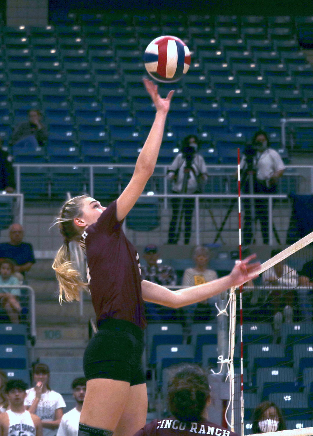 Cinco Ranch’s Emily Killam tips the ball over the net during last year’s bi-district round.
