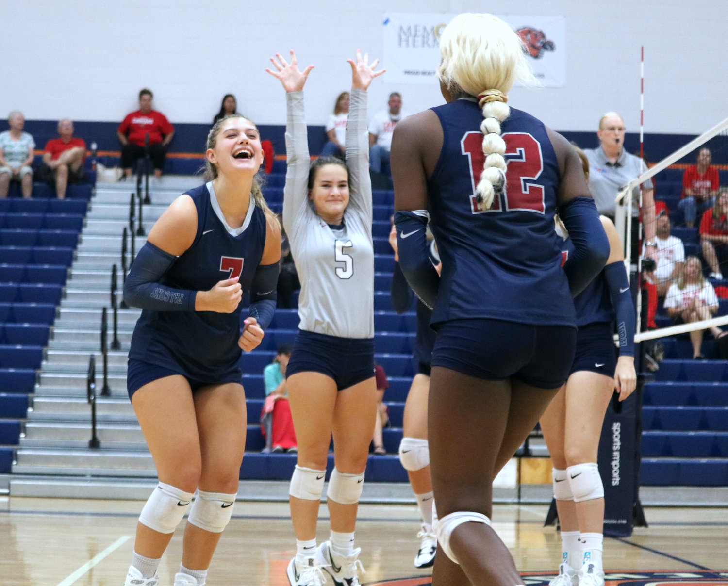 Tompkins players celebrate after winning the second set against Canyon in the finals match of gold bracket Katy ISD/Cy-Fair Tournament at Bridgeland.