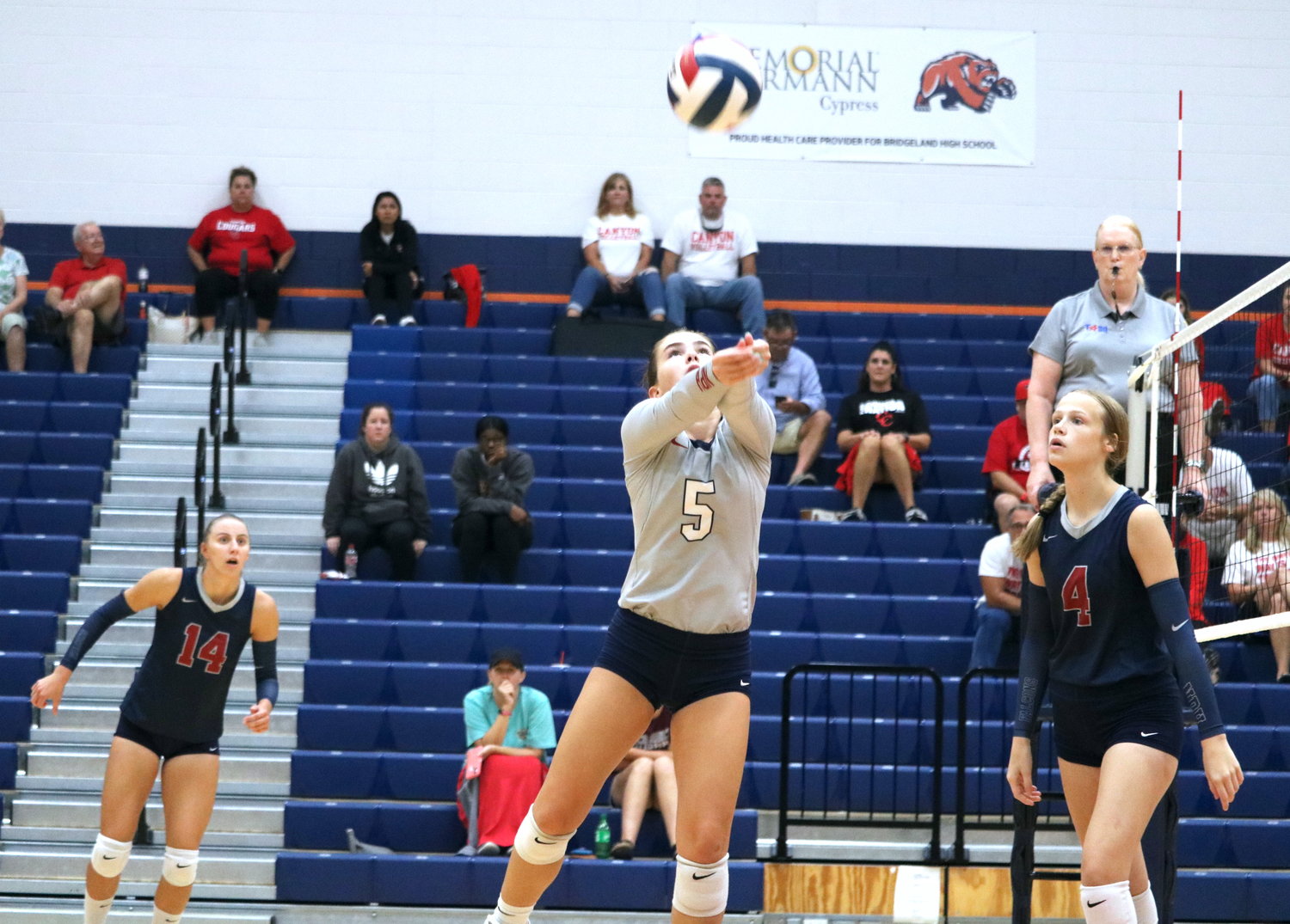 Tompkins’ Brooklynn Merrell sets a ball for a teammate during a match against Canyon in the finals match of gold bracket Katy ISD/Cy-Fair Tournament at Bridgeland.