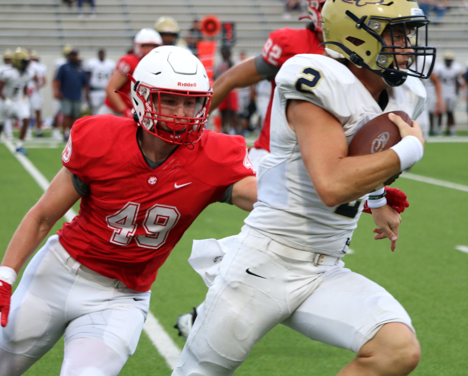 Katy’s Connor Johnsey tries to make a tackle during Katy’s scrimmage against Klein Collins on Friday at Legacy Stadium.