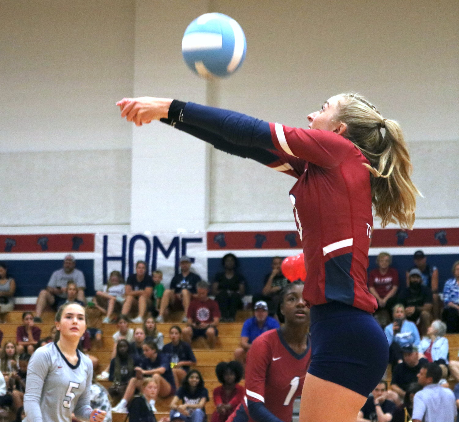 Tompkins’ Presley Powell sets a ball during Tuesday’s match between Tompkins and Katy at the Tompkins gym.