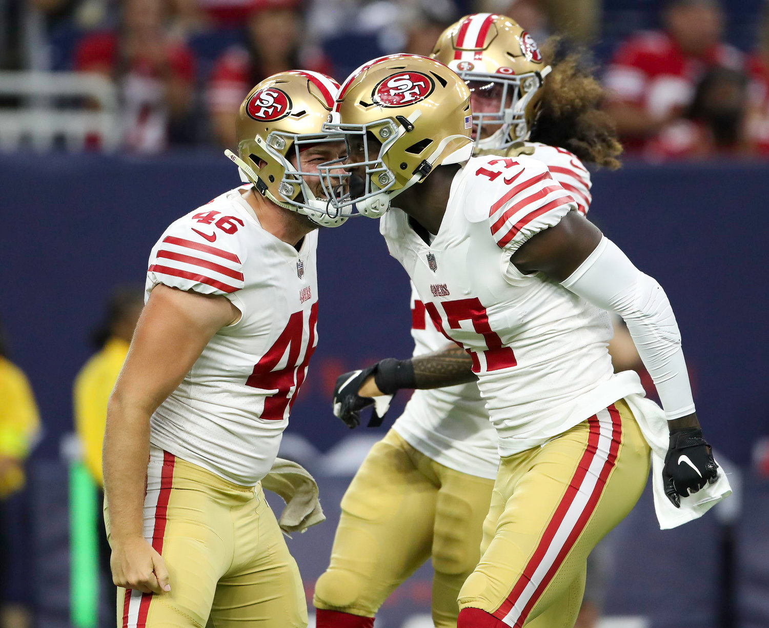 San Francisco 49ers long snapper Taybor Pepper (46) and wide receiver Malik Turner (17) celebrate after a big hit on a punt return during an NFL preseason game between the Texans and the 49ers in Houston, Texas, on August 25, 2022.