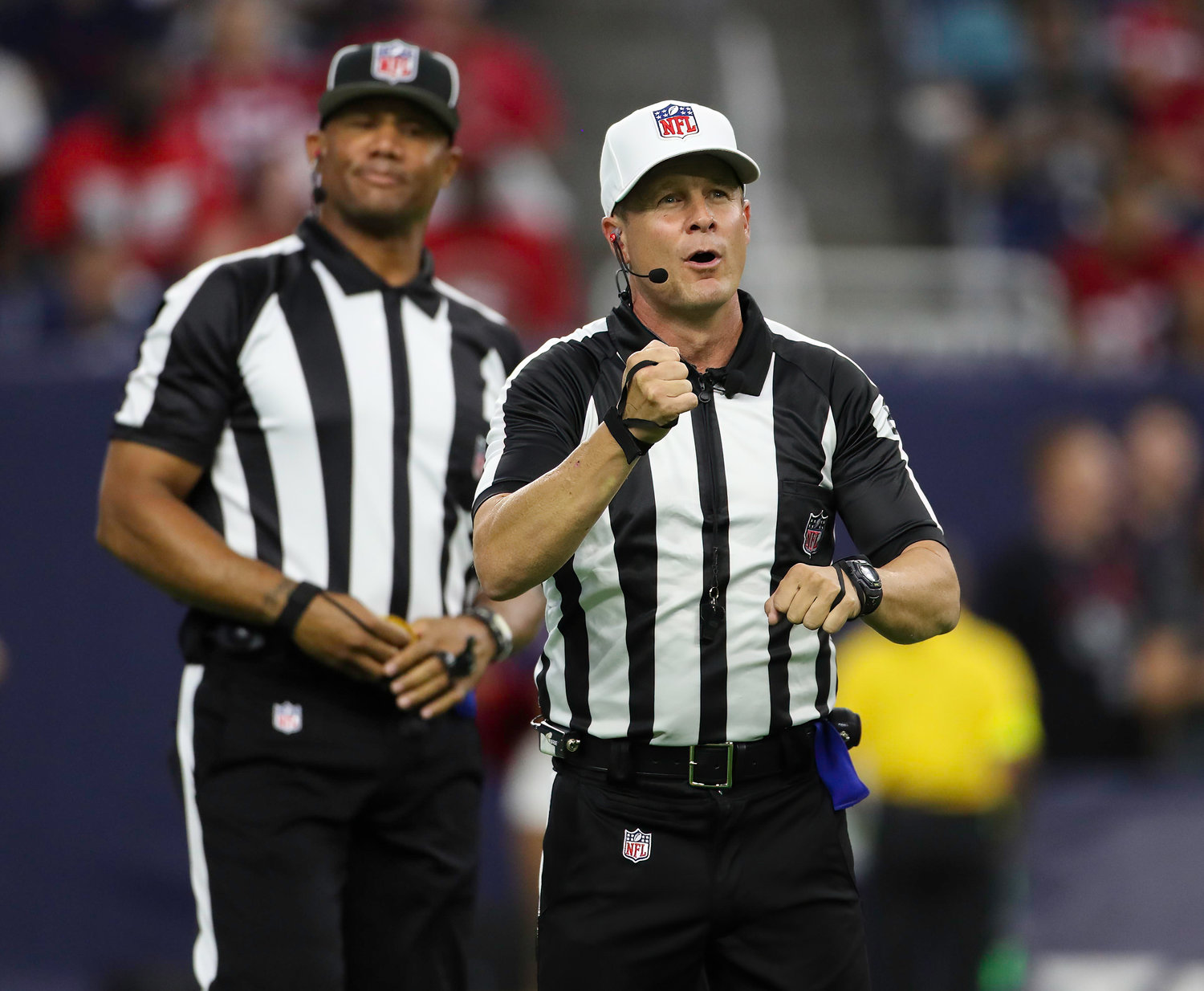 Referee Shawn Hochuli (83) signals a rouging the passer penalty against the San Francisco 49ers during an NFL preseason game between the Texans and the 49ers in Houston, Texas, on August 25, 2022.
