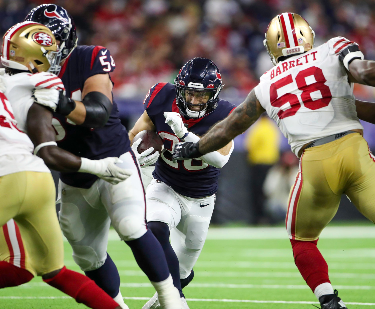 Houston Texans running back Rex Burkhead (28) carries the ball during an NFL preseason game between the Texans and the 49ers in Houston, Texas, on August 25, 2022.