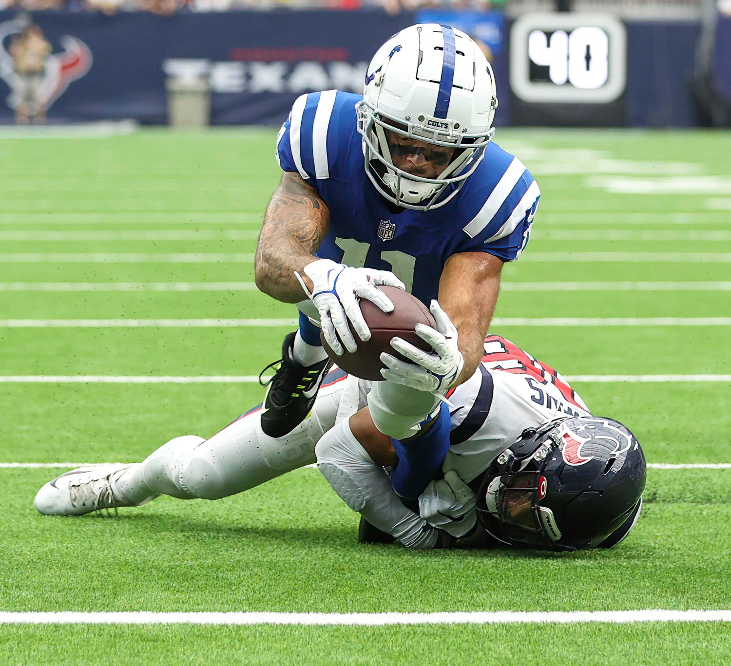 Indianapolis Colts wide receiver Michael Pittman Jr. (11) dives across the goal line to score the game-tying touchdown to bring the Colts back from being down 20-3 in an NFL game between the Texans and the Colts on September 11, 2022 in Houston. The game ended in a 20-20 tie after a scoreless overtime period.