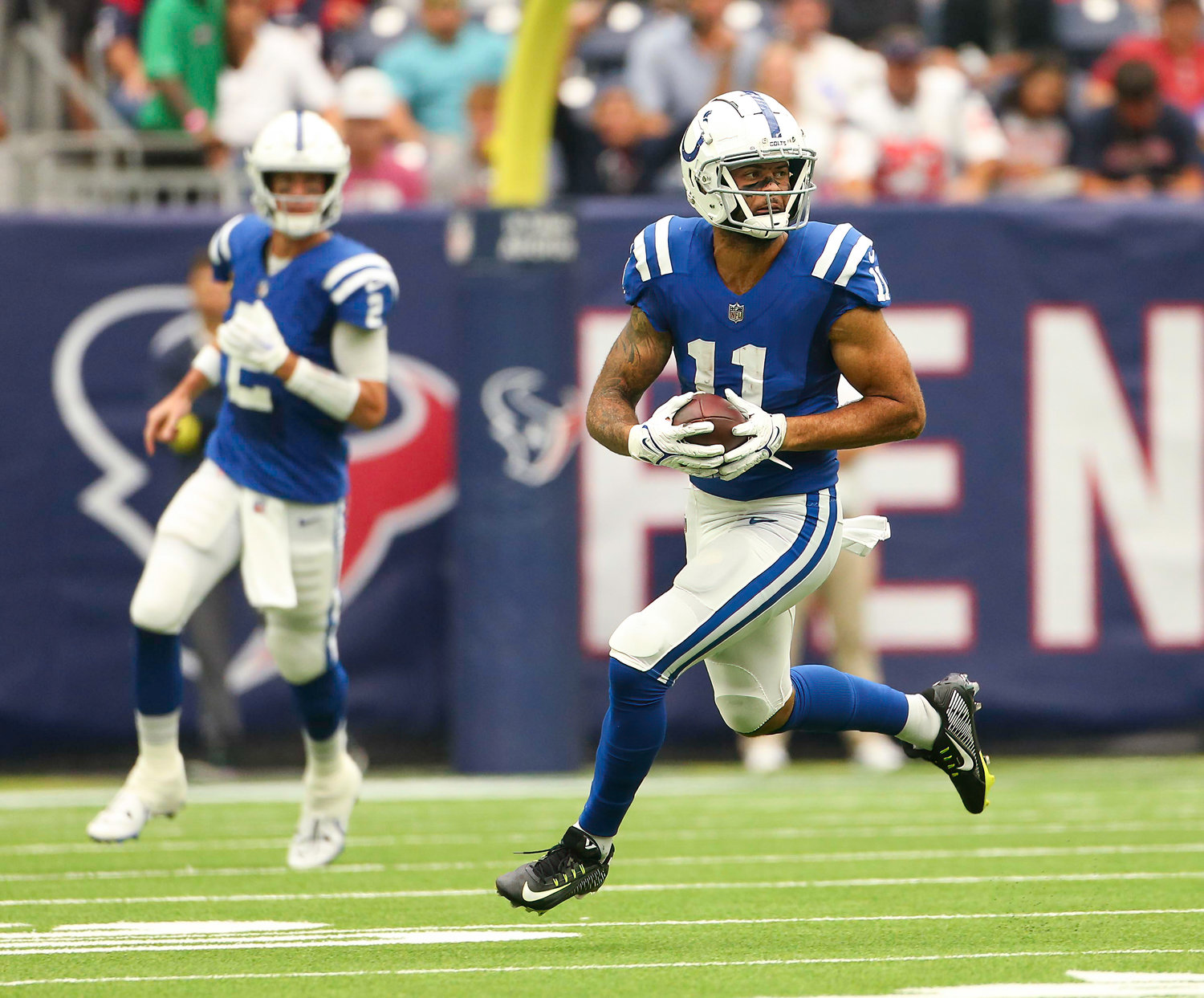 Indianapolis Colts wide receiver Michael Pittman Jr. (11) carries the ball after a catch as quarterback Matt Ryan (2) looks on during an NFL game between the Texans and the Colts on September 11, 2022 in Houston. The game ended in a 20-20 tie after a scoreless overtime period.