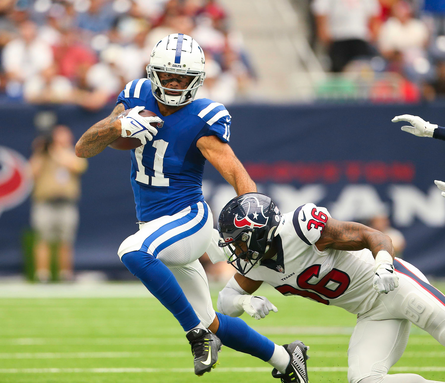 Indianapolis Colts wide receiver Michael Pittman Jr. (11) attempts to evade Houston Texans safety Jonathan Owens (36) during an NFL game between the Texans and the Colts on September 11, 2022 in Houston. The game ended in a 20-20 tie after a scoreless overtime period.