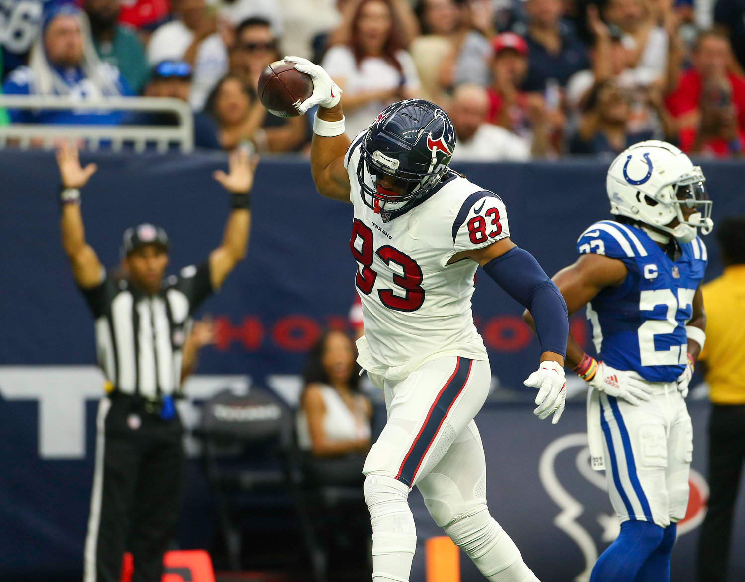 Houston Texans tight end O.J. Howard (83) spikes the ball after scoring on a 16-yard touchdown catch during an NFL game between the Texans and the Colts on September 11, 2022 in Houston. The game ended in a 20-20 tie after a scoreless overtime period.