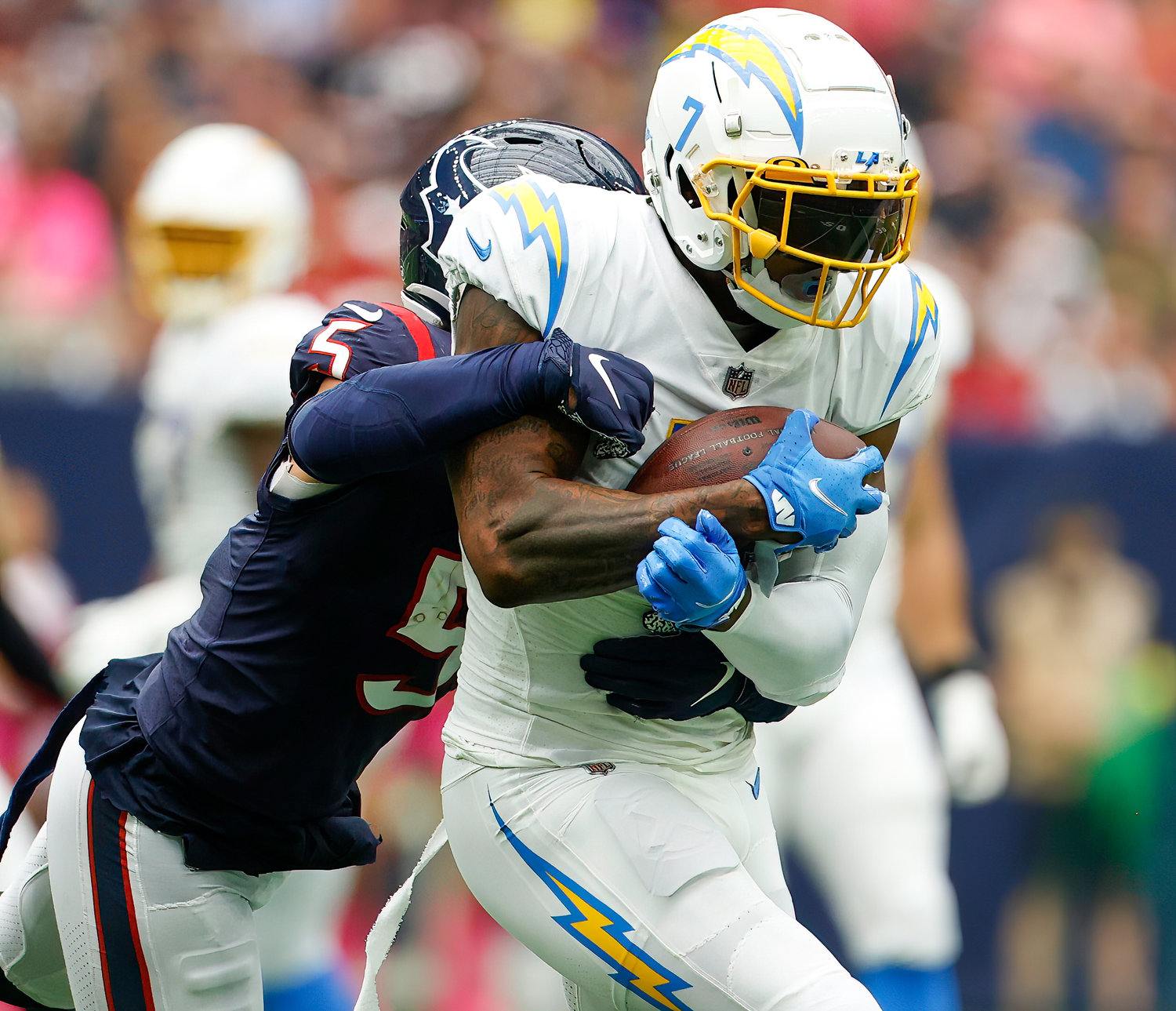 Chargers tight end Gerald Everett (7) holds onto the ball after a catch during an NFL game between the Texans and the Chargers on Oct. 2, 2022 in Houston. The Chargers won 34-24.