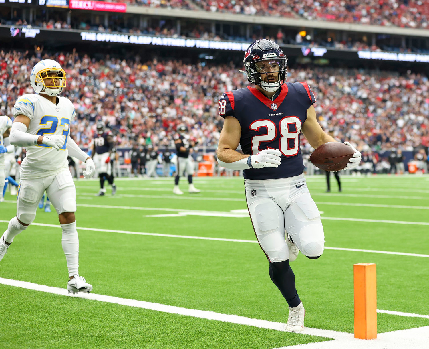 Texans running back Rex Burkhead (28) scores on an 8-yard touchdown catch during an NFL game between the Texans and the Chargers on Oct. 2, 2022 in Houston. The Chargers won 34-24.