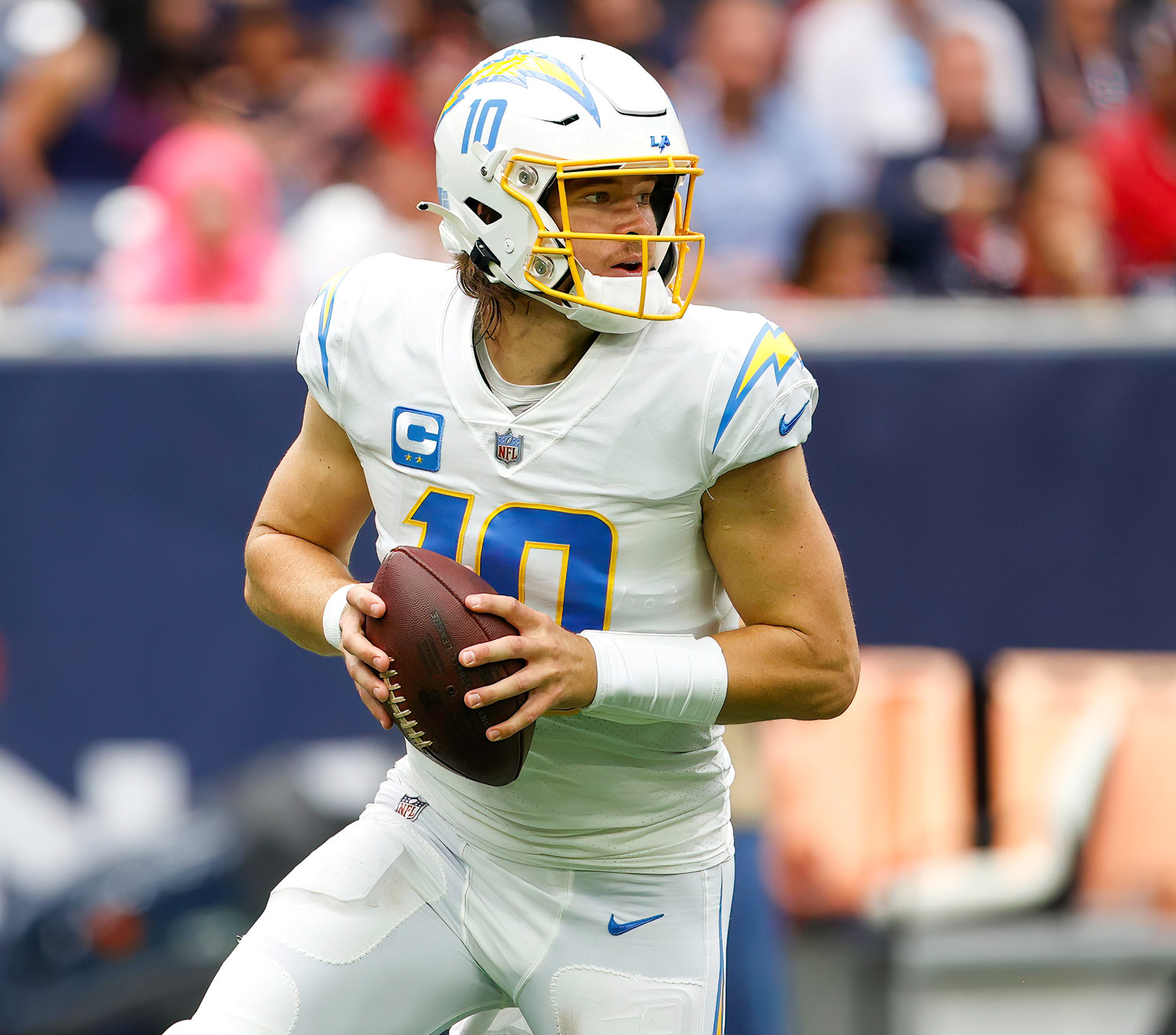 Chargers quarterback Justin Herbert (10) looks to pass during an NFL game between the Texans and the Chargers on Oct. 2, 2022 in Houston. The Chargers won 34-24.