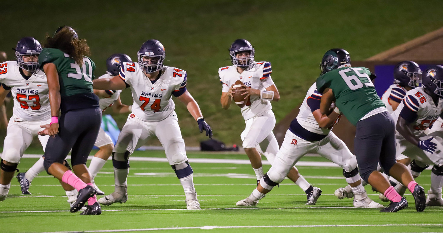 Seven Lakes' Tanner Perez drops back during Friday's game between Seven Lakes and Mayde Creek at Rhodes Stadium.