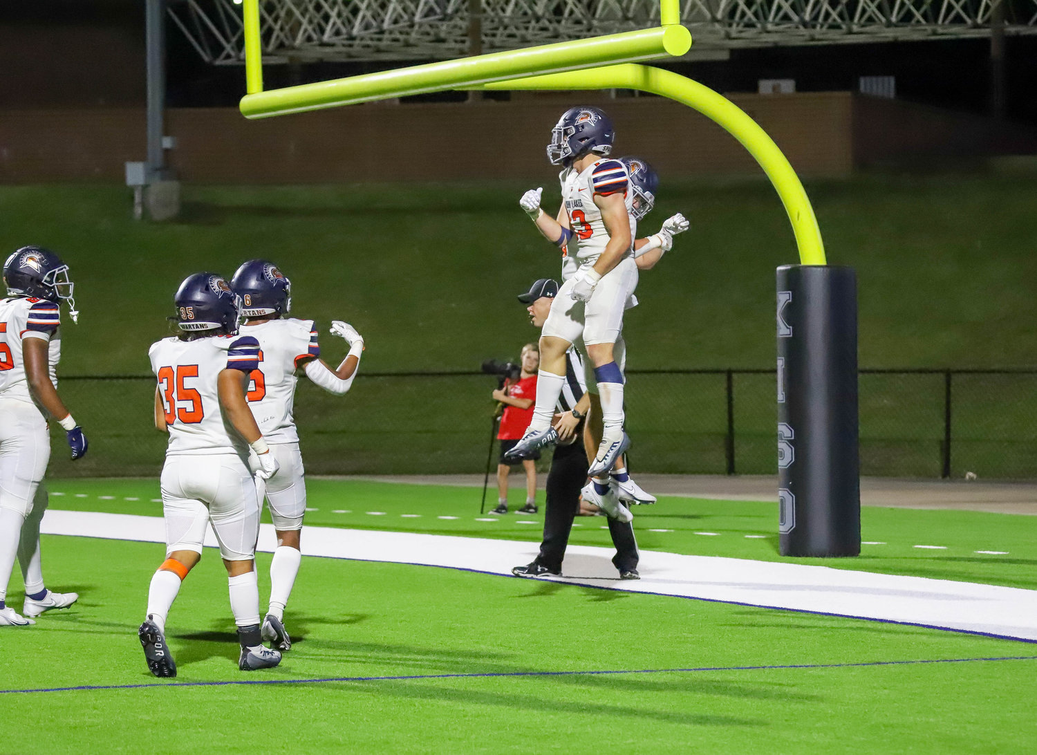 Seven Lakes' Jake Farris celebrates after scoring a touchdown during Friday's game between Seven Lakes and Mayde Creek at Rhodes Stadium.