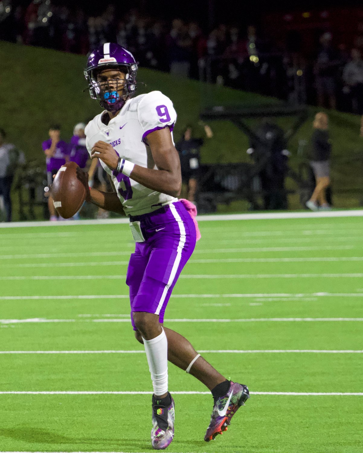 Josh Johnson looks downfield during Thursday's game between Tompkins and Morton Ranch at Rhodes Stadium.