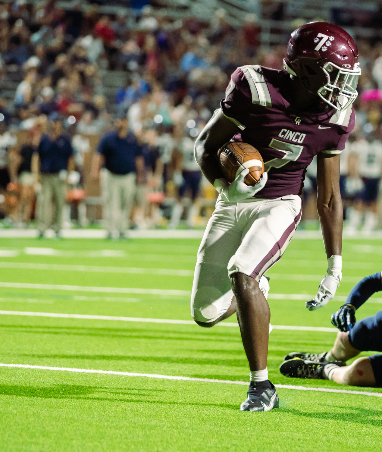 Cinco Ranch’s Sam McKnight runs into the endzone during a game between Cinco Ranch and Tompkins at Rhodes Stadium.