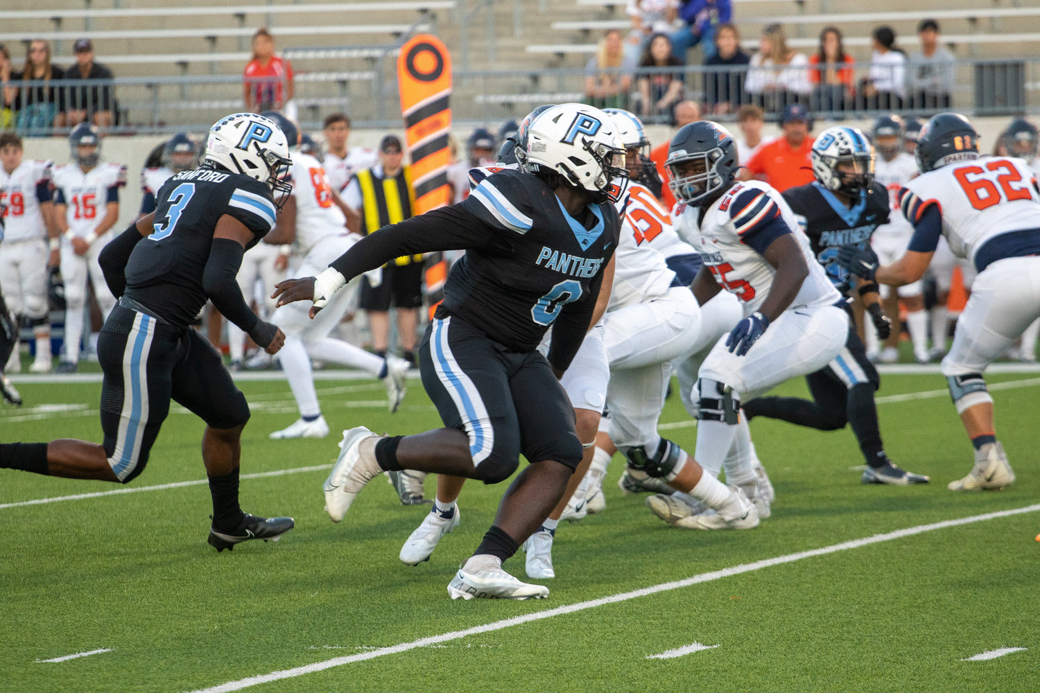 Paetow's D.J. Hicks fights through a blocker during Thursday's game between Paetow and Seven Lakes at Legacy Stadium.