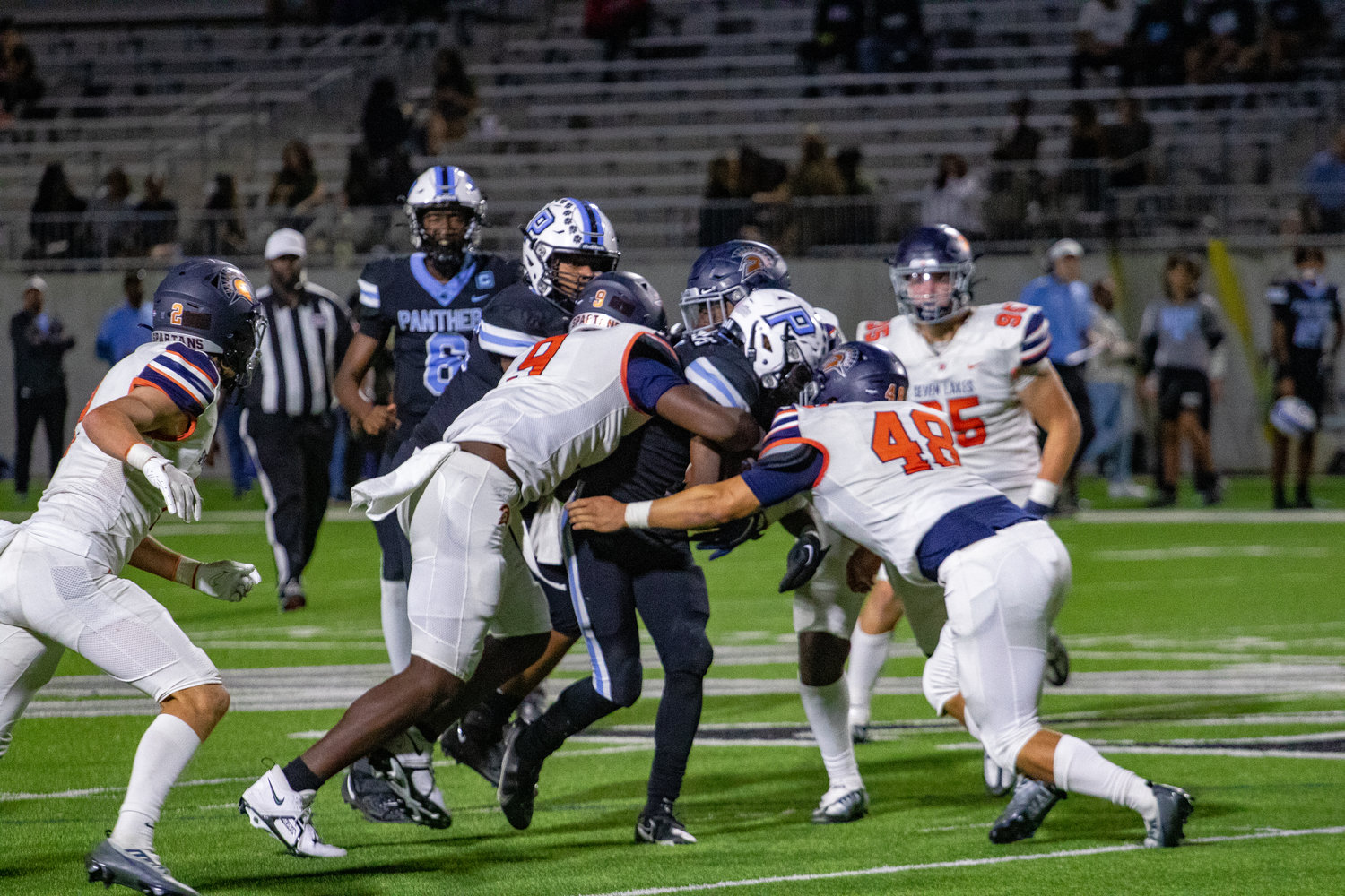 Paetow's Damyrion Phillips is wrapped up by the Seven Lakes defense during Thursday's game between Paetow and Seven Lakes at Legacy Stadium.