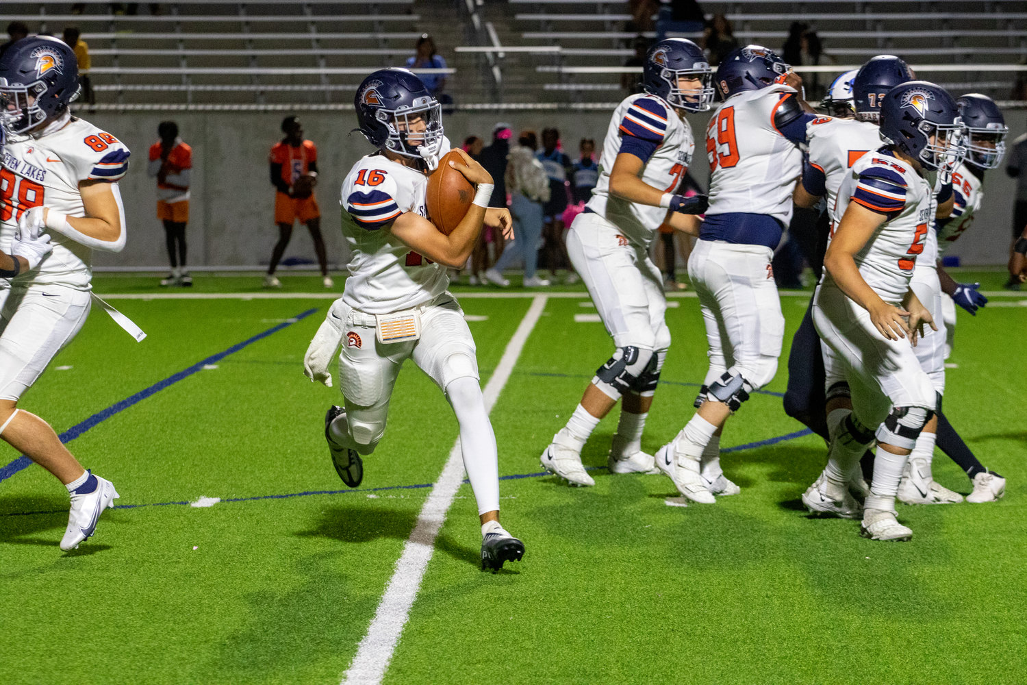 Seven Lakes Collin Mills runs the ball during Thursday's game between Paetow and Seven Lakes at Legacy Stadium.
