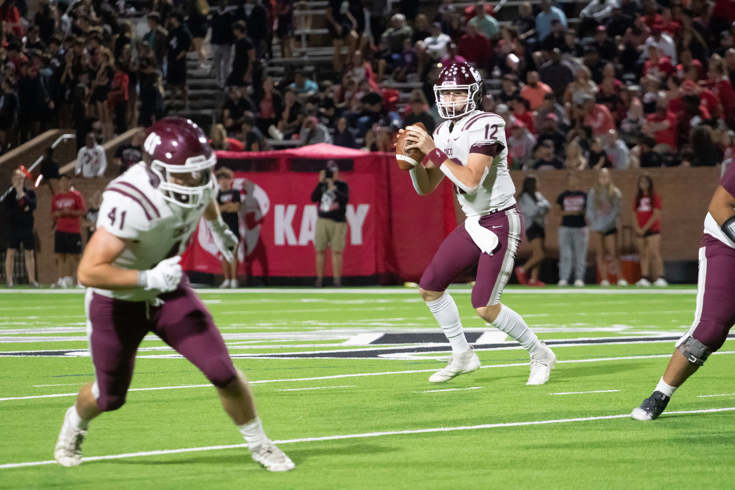 Cinco Ranch's Gavin Rutherford looks to pass during Friday's game between Katy and Cinco Ranch at Rhodes Stadium.