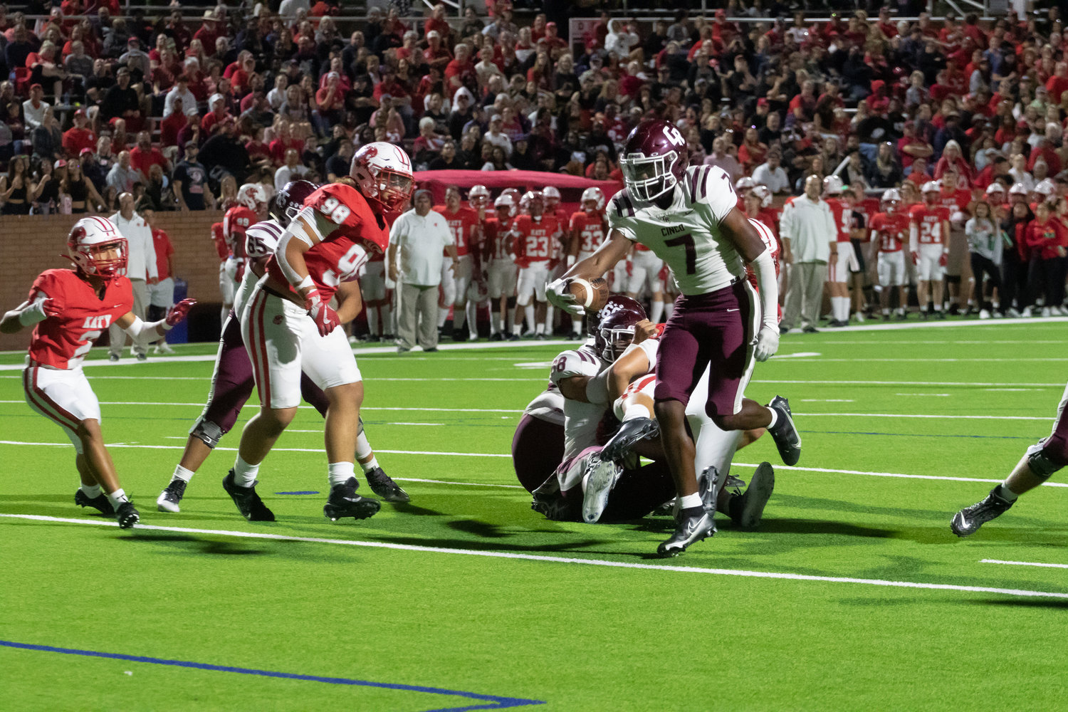 Cinco Ranch's Sam McKnight runs in a touchdown during Friday's game between Katy and Cinco Ranch at Rhodes Stadium.