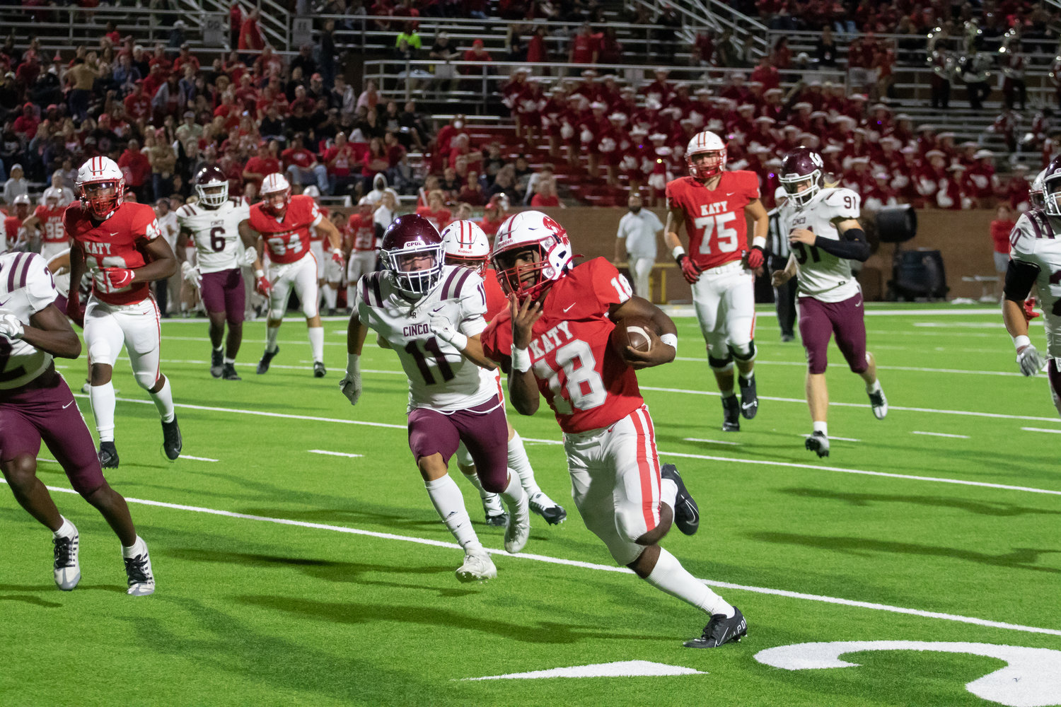 Katy's Dallas Glass runs in a touchdown during Friday's game between Katy and Cinco Ranch at Rhodes Stadium.