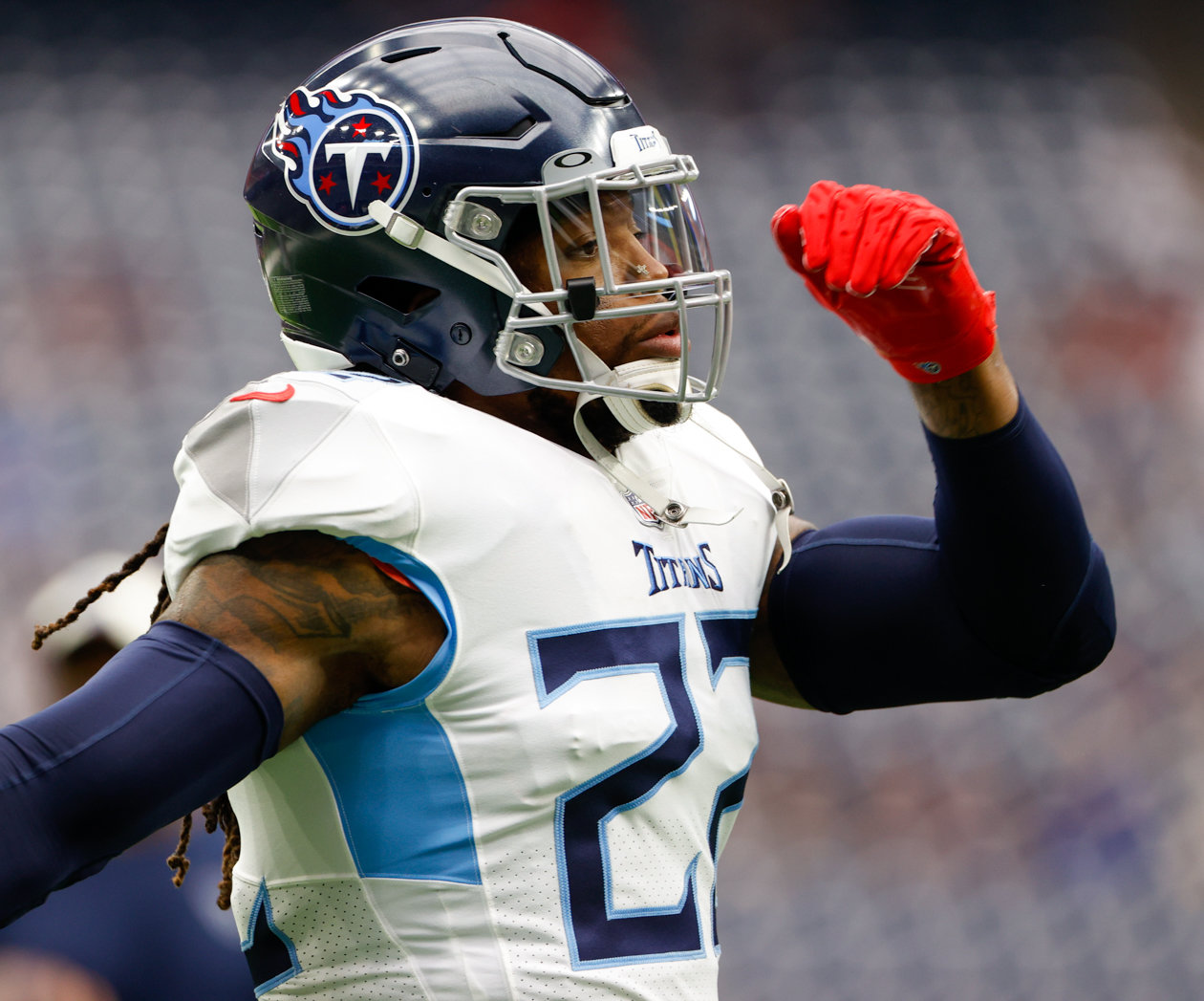 Titans running back Derrick Henry (22) warms up before the start of an NFL game between the Texans and the Titans on Oct. 30, 2022 in Houston.