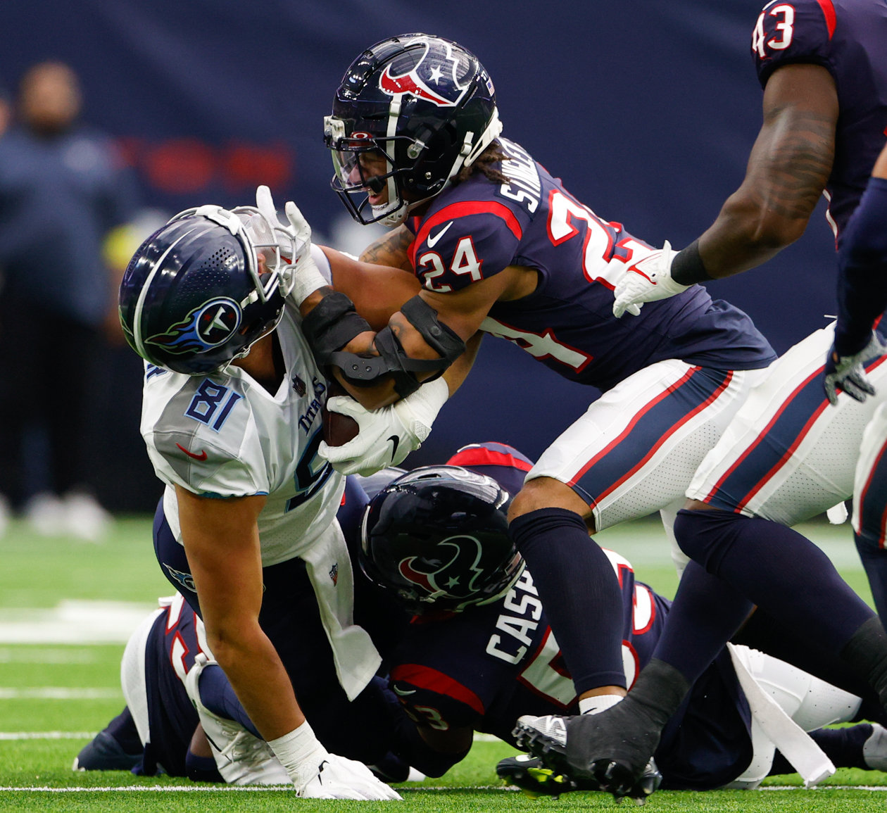 Texans cornerback Derek Stingley Jr. (24) tackles Titans wide receiver Cody Hollister (8) and is not flagged for a facemask on the play during an NFL game between the Texans and the Titans on Oct. 30, 2022 in Houston.