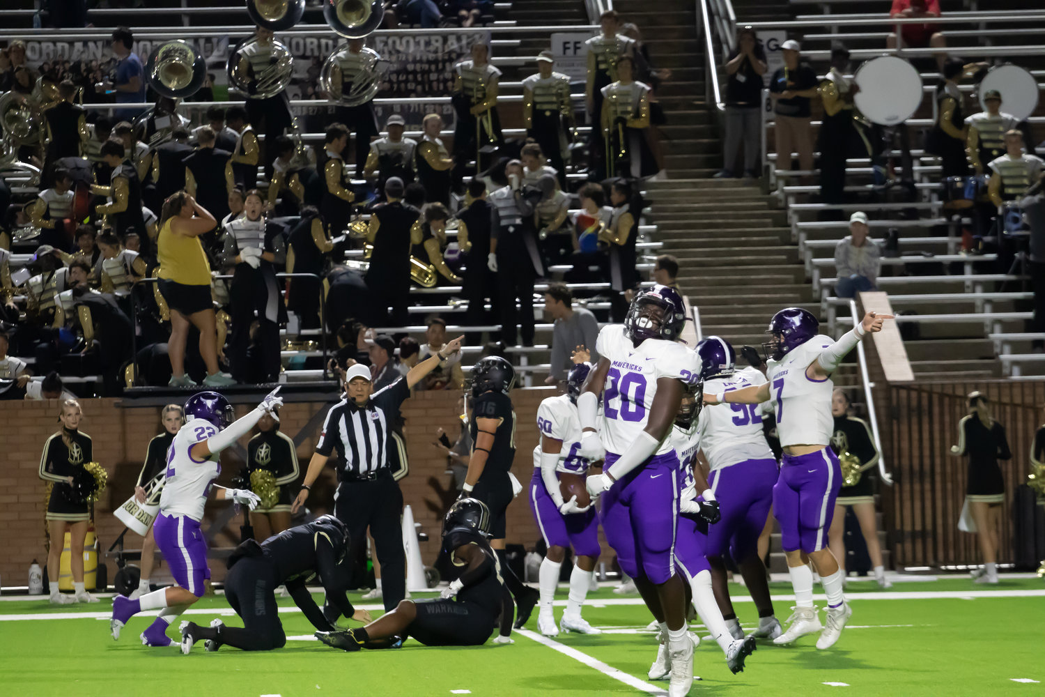 Morton Ranch players celebrate after making a fourth down stop during Thursday's game between Morton Ranch and Jordan at Rhodes Stadium.