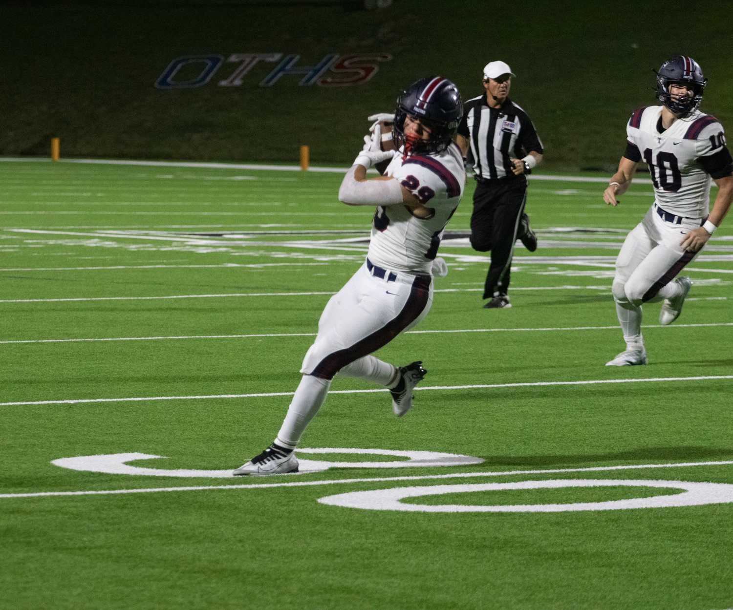 Tompkins' Dylan Rodriguez catches a pass during Friday's game between Tompkins and Paetow at Rhodes Stadium.