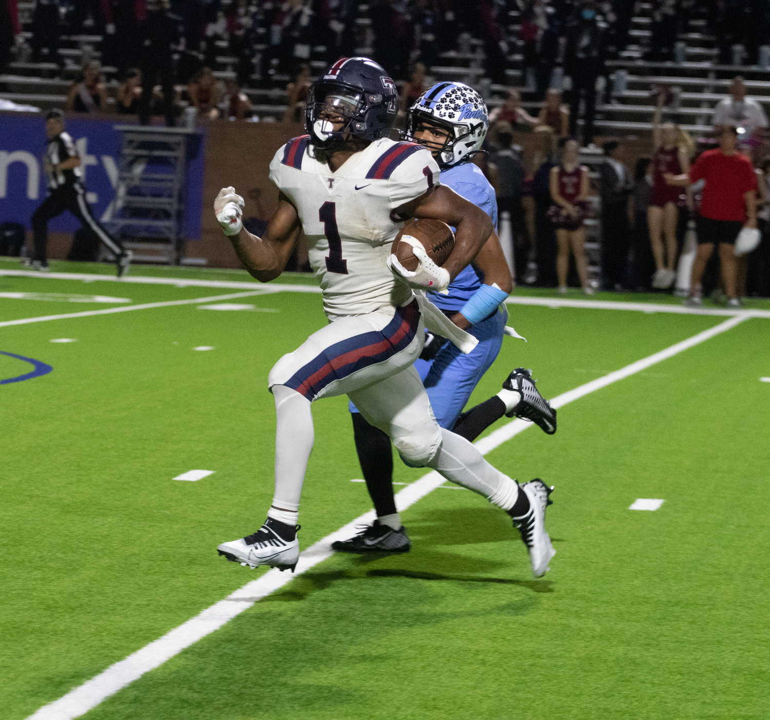 Tompkins' Caleb Komolafe runs in a touchdown during Friday's game between Tompkins and Paetow at Rhodes Stadium.