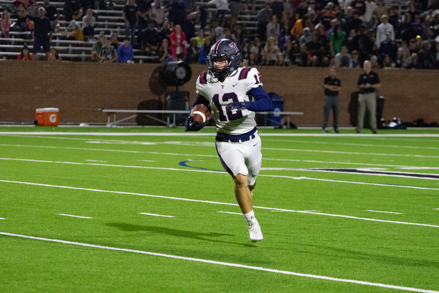 Tompkins' Braden Foor returns an  interception during Friday's game between Tompkins and Paetow at Rhodes Stadium.