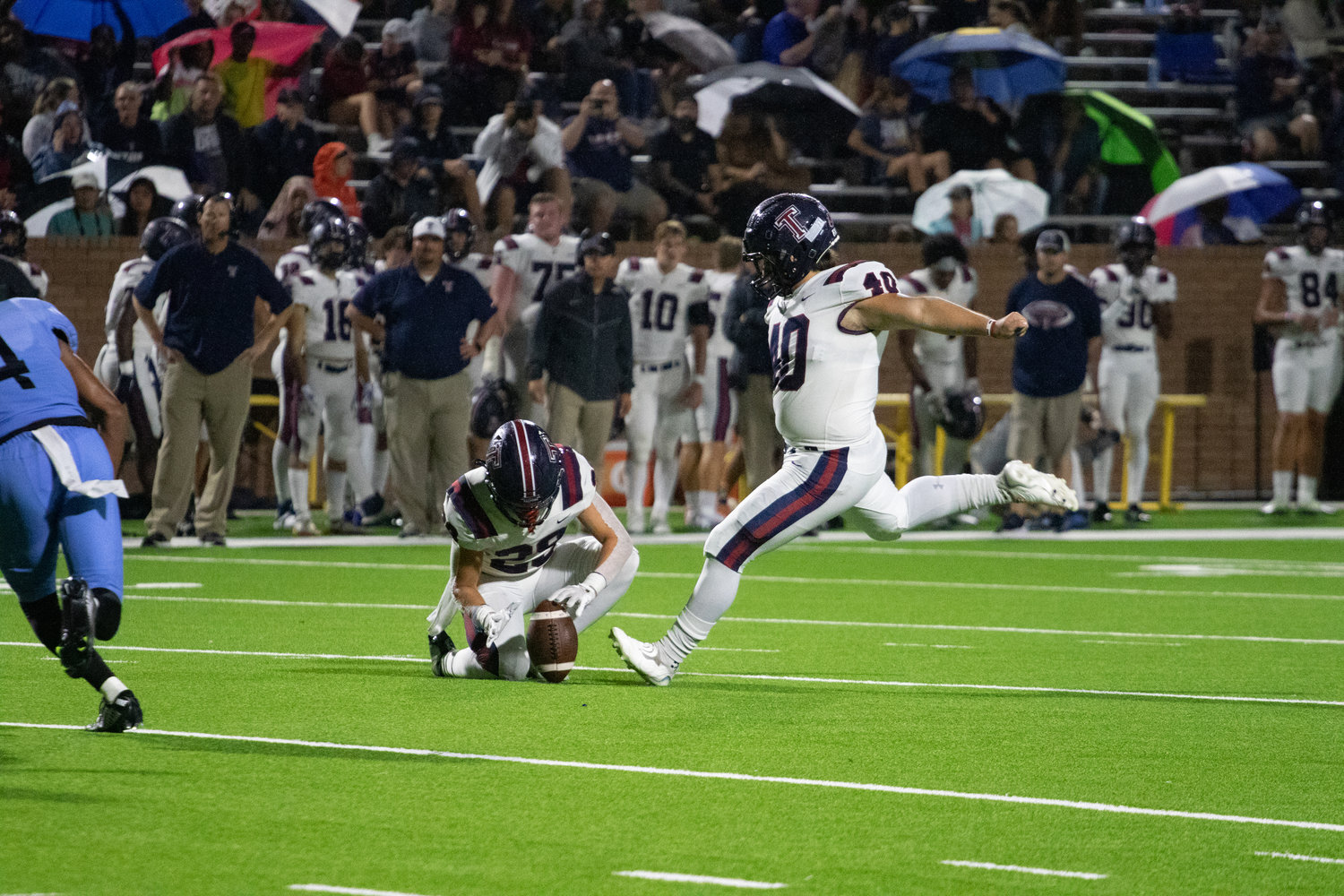 Tompkins' Andrew Horner kicks an extra point during Friday's game between Tompkins and Paetow at Rhodes Stadium.