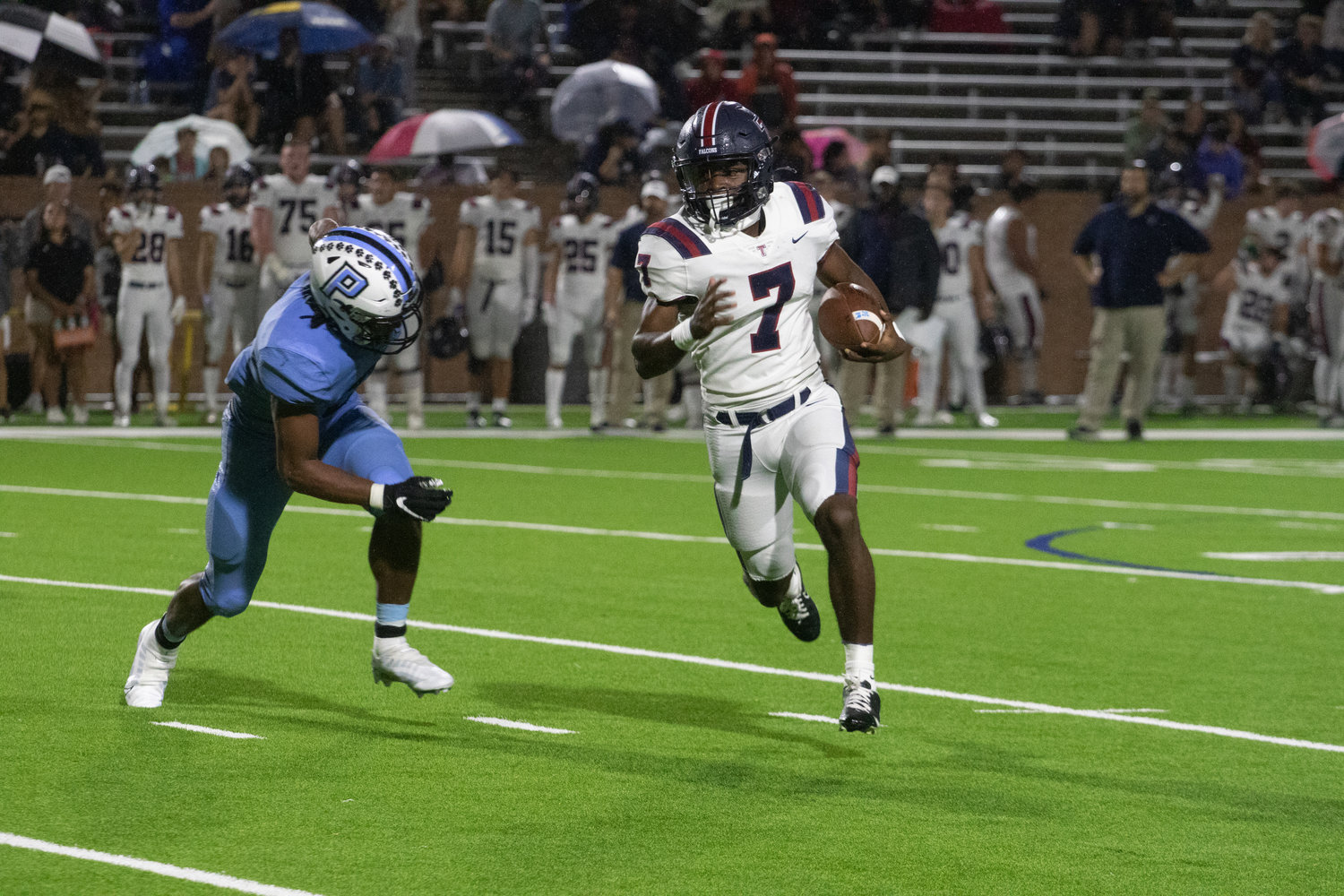 Chris Gilbert Jr. runs past a defender during Friday's game between Tompkins and Paetow at Rhodes Stadium.