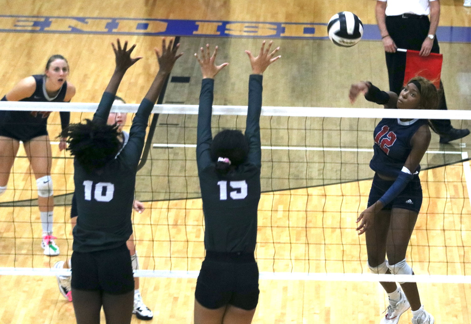 Tompkins Cindy Tchouangwa spikes a ball during Tuesday's match between Tompkins and Ridge Point at Wheeler Field House.