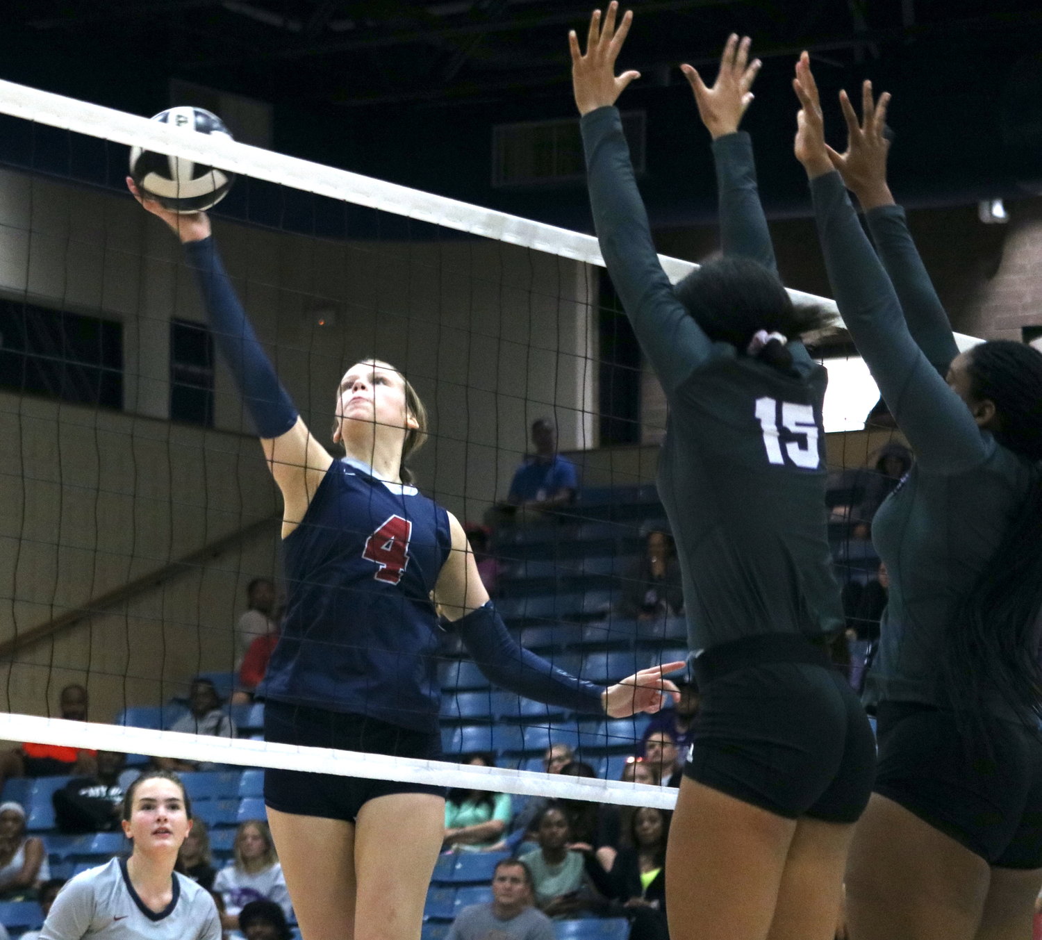 Callie Funk makes a kill attempt during Tuesday's match between Tompkins and Ridge Point at Wheeler Field House.
