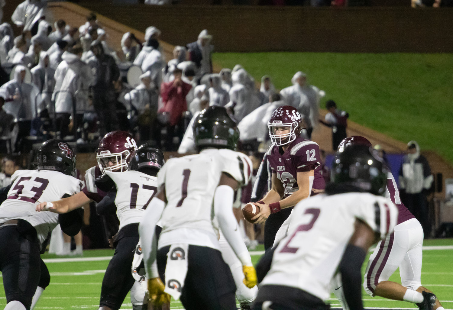 Gavin Rutherford takes a snap during Friday's game between Cinco Ranch and George Ranch at Rhodes Stadium.