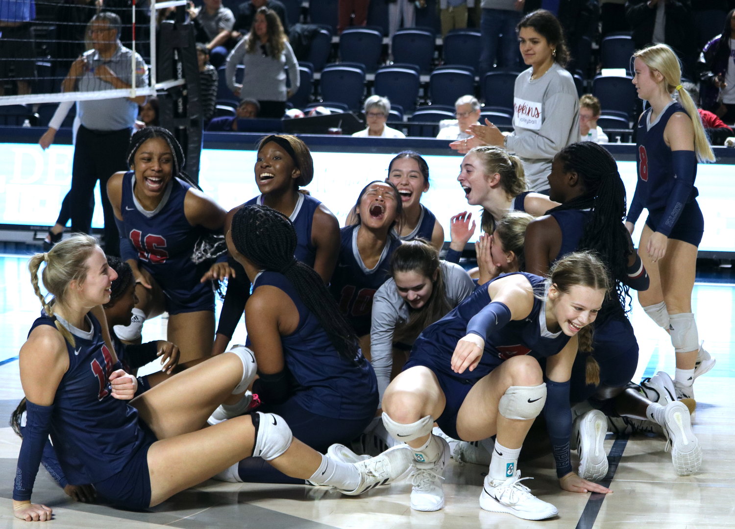 Tompkins players celebrate after winning the Class 6A-Region III final against Cinco Ranch at Delmar Fieldhouse on Saturday.