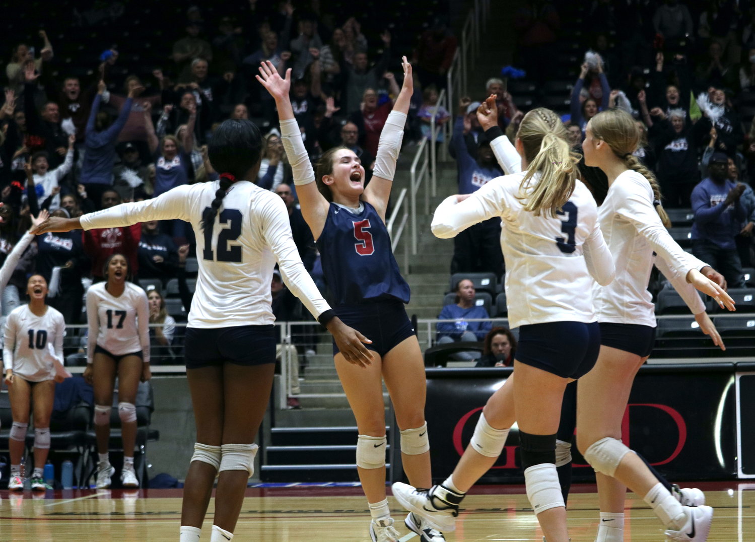Tompkins celebrates after winning the first set during Friday's Class 6A State Semifinal between Tompkins and Keller on Friday at the Curtis Culwell Center in Garland.