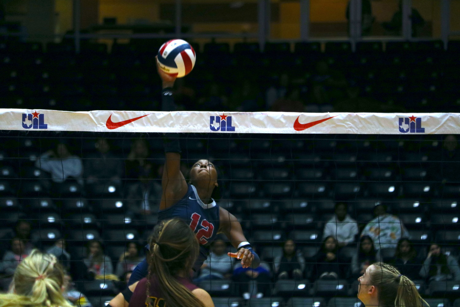 Cindy Tchouangwa spikes the ball during Saturday's state final between Tompkins and Dripping Springs at the Curtis Culwell Center in Garland.