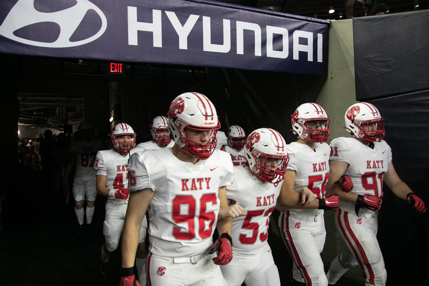 Katy players head to the field before Friday's Class 6A-Division II Region III Final between Katy and C.E. King at NRG Stadium.