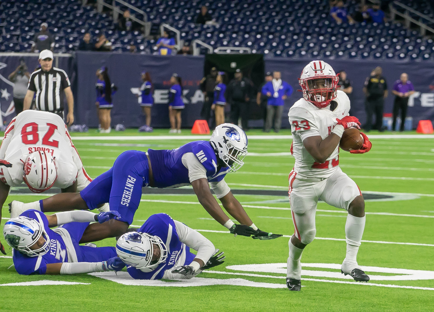 Seth Davis runs past a defender during Friday's Class 6A-Division II Region III Final between Katy and C.E. King at NRG Stadium.