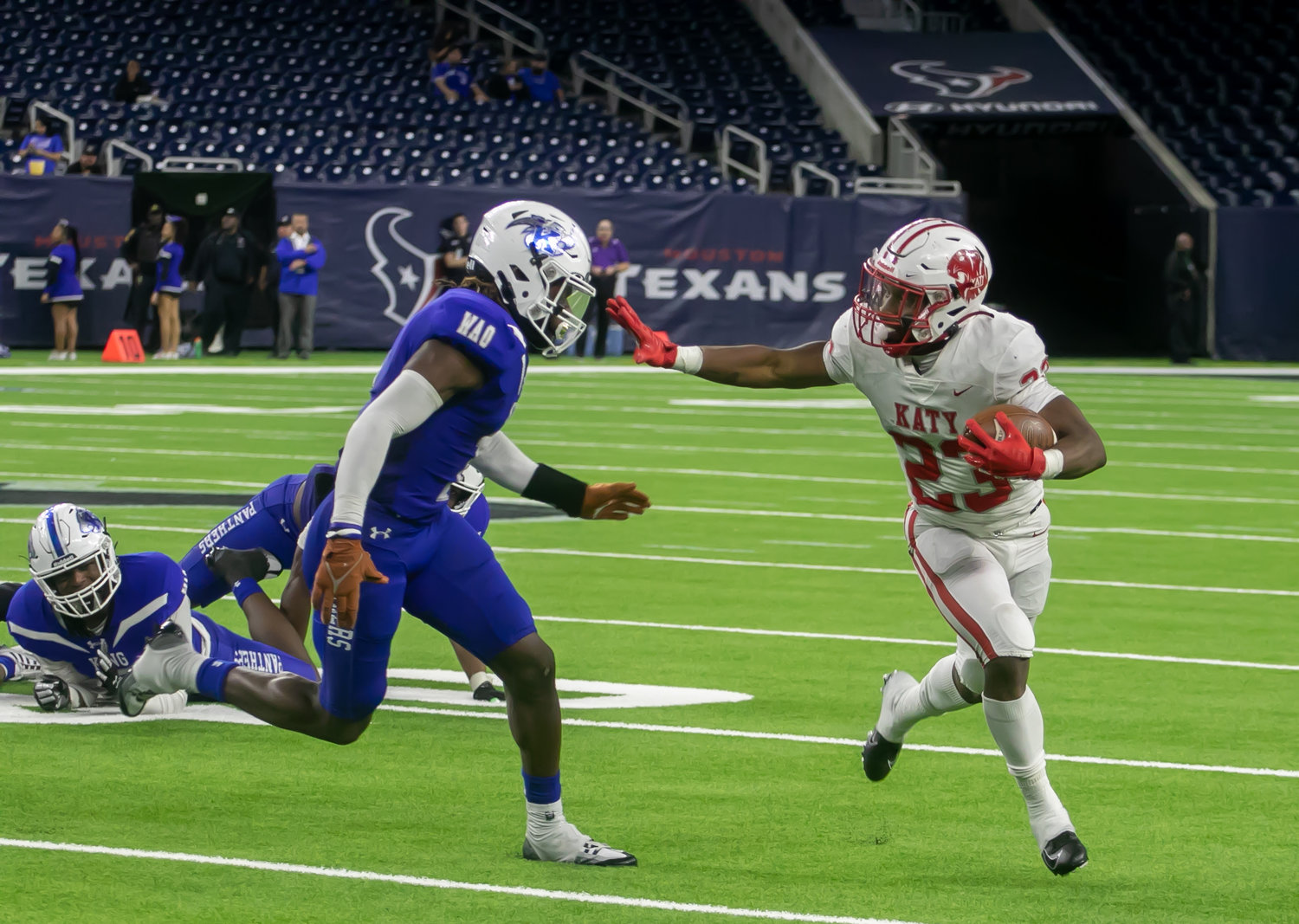 Seth Davis stiff-arms a defender during Friday's Class 6A-Division II Region III Final between Katy and C.E. King at NRG Stadium.