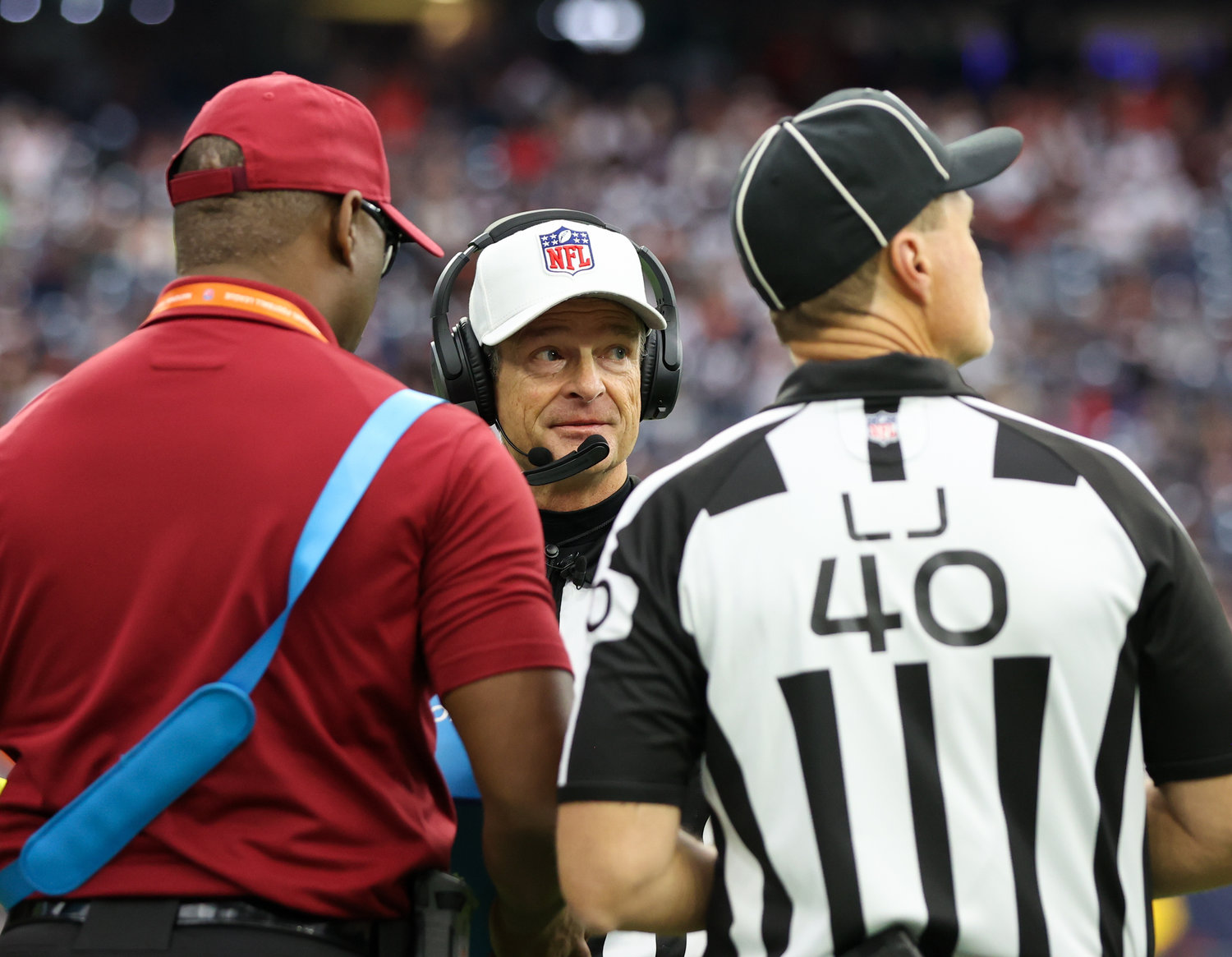 Referee Land Clark (130) and line judge Brian Bolinger (40) during a video review in an NFL game between the Houston Texans and the Cleveland Browns on Dec. 4, 2022, in Houston. The Browns won, 27-14.